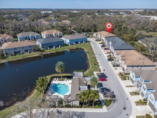 bird's eye view featuring a water view and a residential view