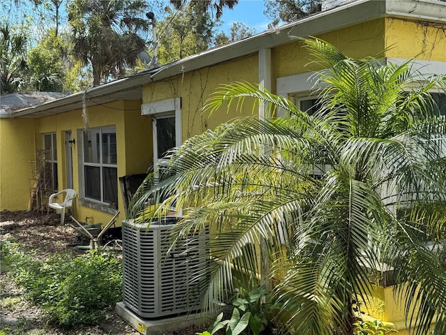 view of side of home with stucco siding