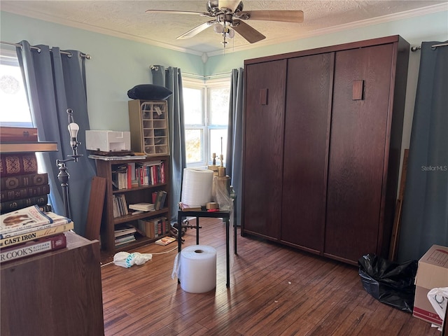 office featuring ornamental molding, a textured ceiling, and hardwood / wood-style floors