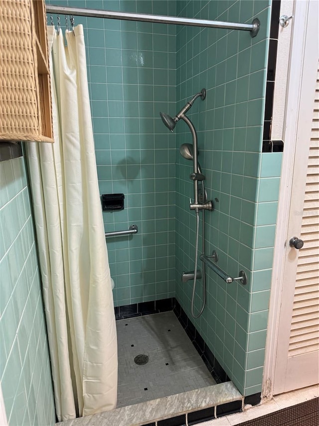 bathroom with a shower stall