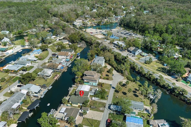 bird's eye view featuring a residential view and a water view