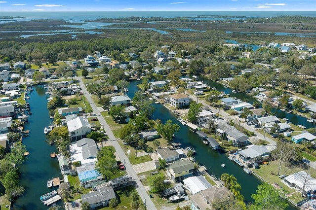 birds eye view of property featuring a water view and a residential view