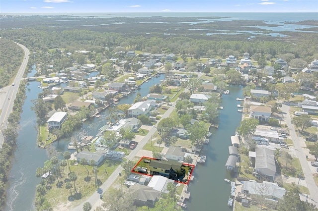 birds eye view of property featuring a water view and a residential view