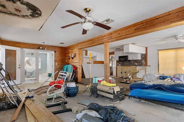 interior space featuring ceiling fan and visible vents