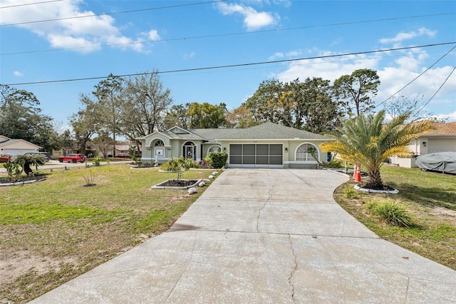 ranch-style house with concrete driveway, an attached garage, and a front lawn