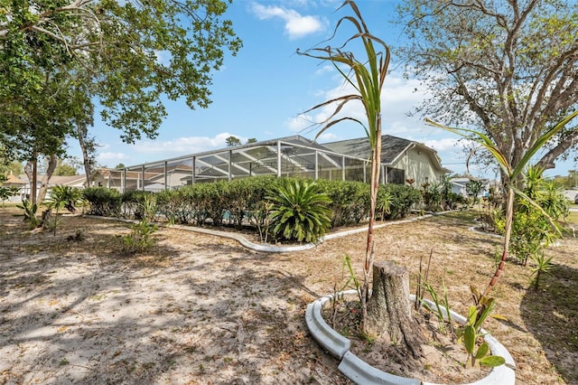 view of yard featuring a lanai