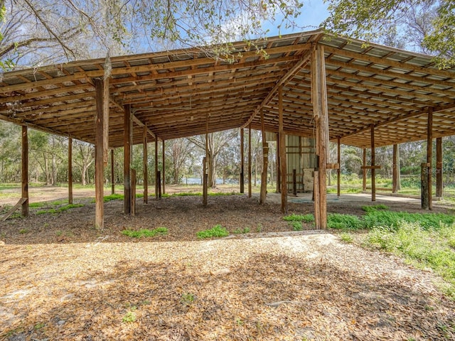 view of home's community featuring a detached carport and driveway