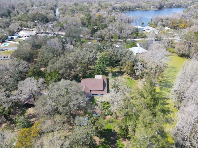 bird's eye view with a forest view and a water view