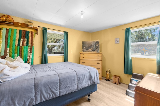 bedroom with light wood finished floors