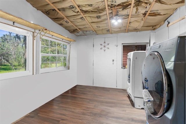 below grade area featuring wood finished floors and washing machine and clothes dryer