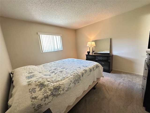 bedroom with a textured ceiling, carpet flooring, and baseboards