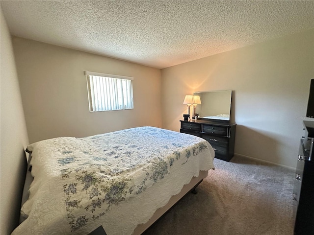 bedroom featuring carpet flooring, a textured ceiling, and baseboards