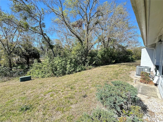 view of yard featuring central AC unit