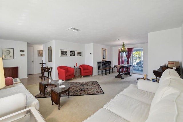 living room featuring carpet floors and visible vents