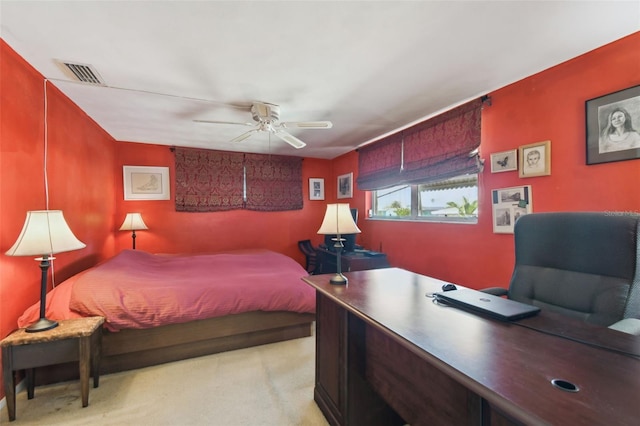 bedroom featuring ceiling fan, light carpet, and visible vents