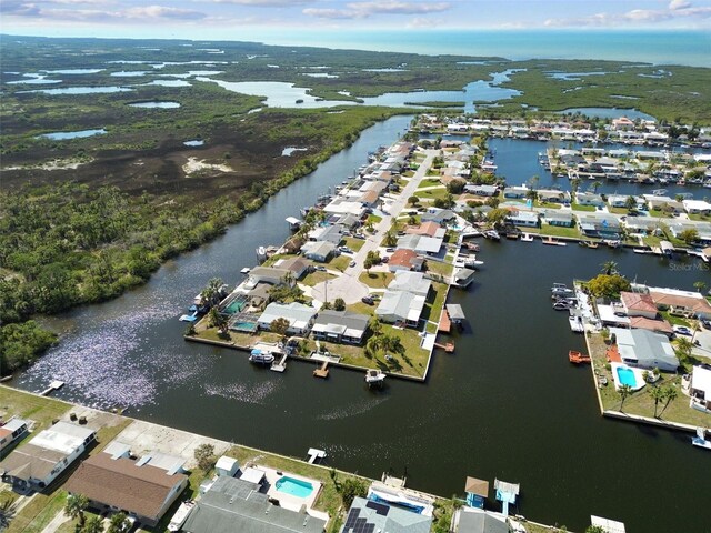 drone / aerial view with a residential view and a water view