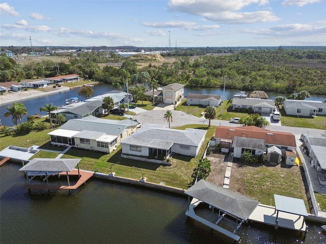 drone / aerial view featuring a water view and a residential view