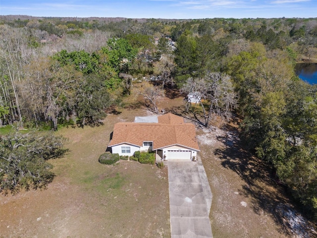 aerial view featuring a wooded view