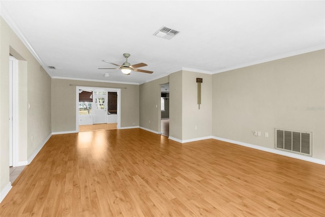 spare room featuring visible vents, light wood-style flooring, and ceiling fan