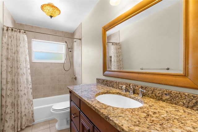 full bath featuring vanity, tile patterned floors, toilet, and shower / bath combo