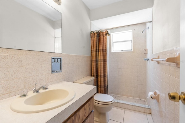 full bathroom featuring tile patterned floors, toilet, a stall shower, tile walls, and vanity