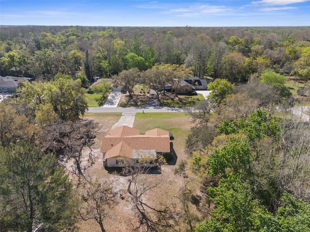 aerial view with a wooded view