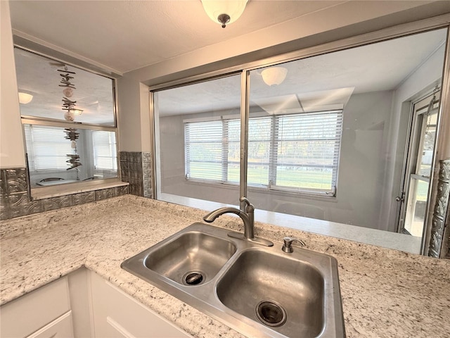 kitchen with white cabinets and a sink