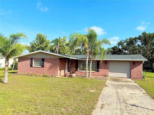 9512 Sunshine Blvd, New Port Richey, FL 34654 - single story home featuring a garage, brick siding, concrete driveway, and a front lawn