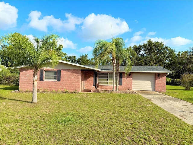 9512 Sunshine Blvd, New Port Richey, FL 34654 - ranch-style home featuring driveway, a garage, a front yard, and brick siding