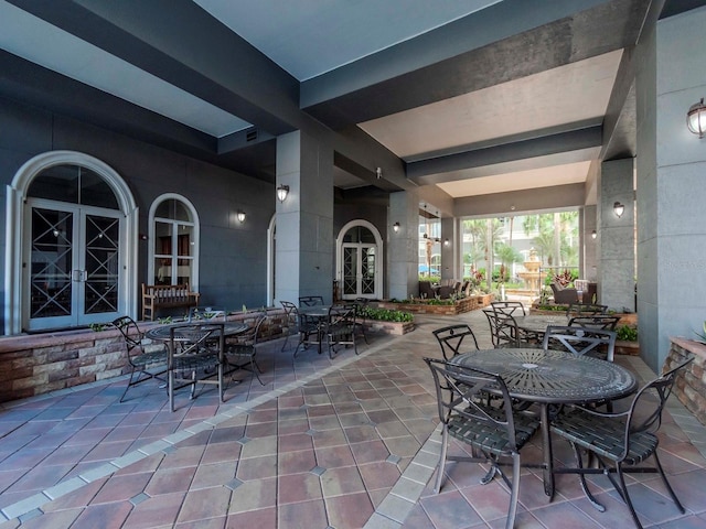 view of patio featuring outdoor dining space and french doors