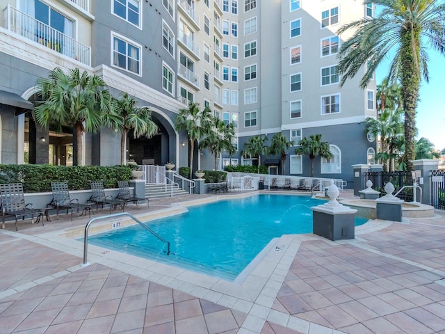 community pool with a patio