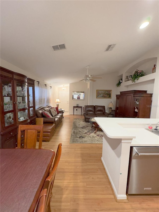 interior space featuring light wood-style flooring, visible vents, and dishwasher