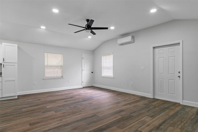 unfurnished room with recessed lighting, a ceiling fan, vaulted ceiling, dark wood-style floors, and a wall mounted air conditioner