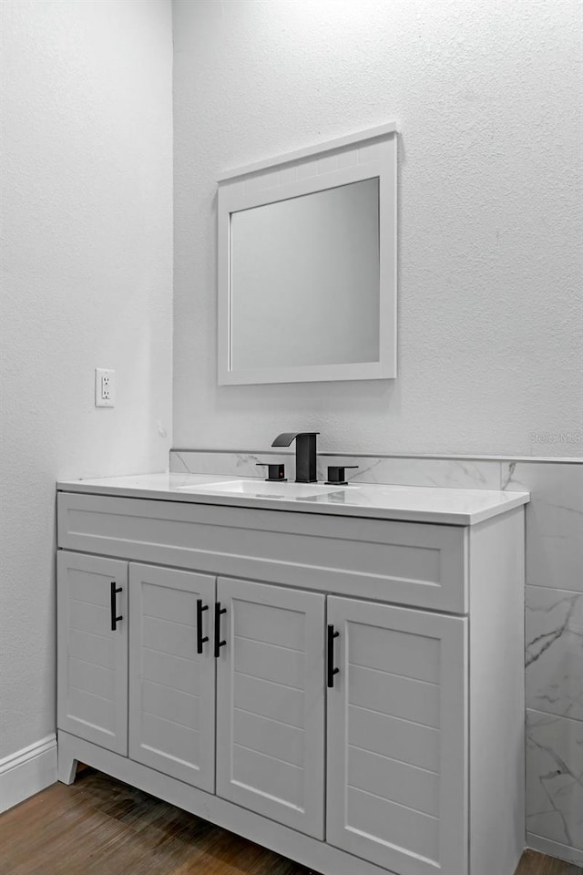 bathroom featuring wood finished floors and vanity