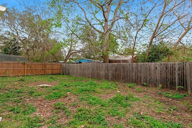 view of yard featuring a fenced backyard