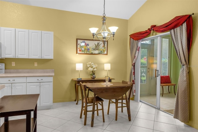 dining area featuring a chandelier, lofted ceiling, baseboards, and light tile patterned floors