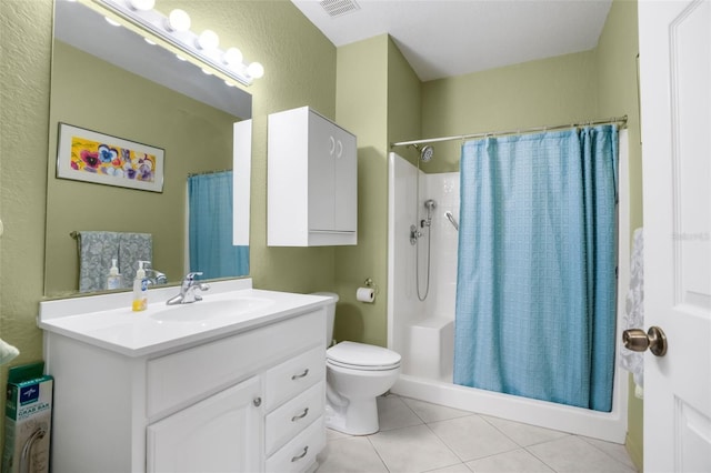 full bathroom featuring visible vents, toilet, a shower with shower curtain, vanity, and tile patterned flooring