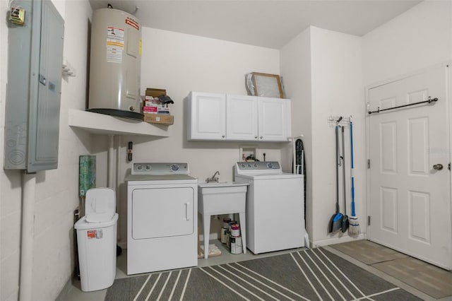 laundry area with washing machine and dryer, electric panel, and cabinet space