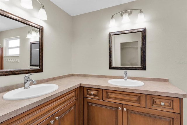 full bath featuring double vanity and a sink