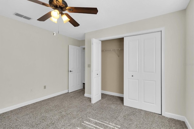 unfurnished bedroom with carpet floors, baseboards, visible vents, and a closet