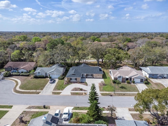 bird's eye view with a forest view and a residential view