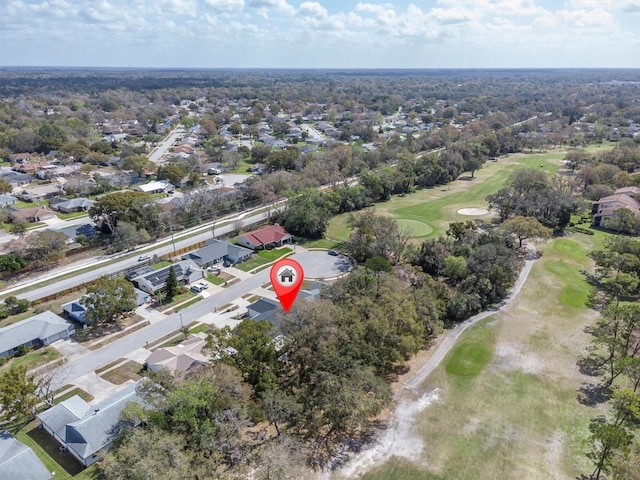 drone / aerial view with a residential view and golf course view