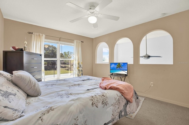 bedroom with carpet, ceiling fan, and baseboards