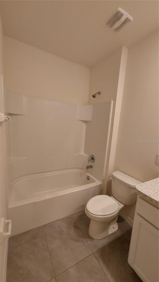 full bath featuring shower / bath combination, visible vents, toilet, tile patterned floors, and vanity