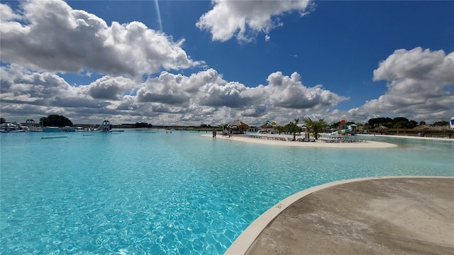 community pool featuring a water view