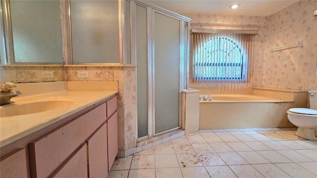 full bathroom with toilet, vanity, a shower stall, a bath, and wallpapered walls