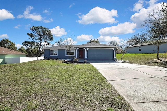 ranch-style house featuring stucco siding, concrete driveway, fence, a garage, and a front lawn