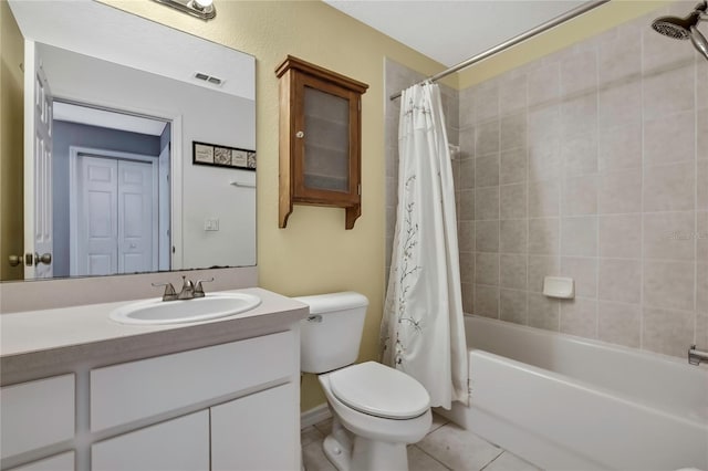 bathroom featuring visible vents, toilet, tile patterned floors, shower / bath combo with shower curtain, and vanity