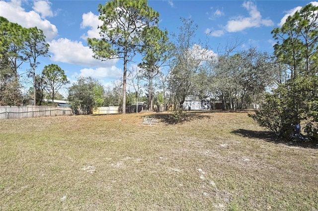 view of yard with fence