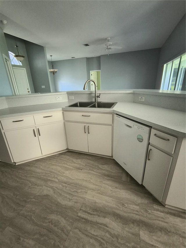 11257 Frigate Bird Ave, Weeki Wachee, FL 34613 - kitchen featuring dishwasher, a ceiling fan, white cabinetry, and light countertops